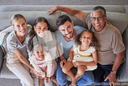 Image of Smile, happy big family on sofa and top view of generations, grandparents and parents together in living room. Diversity portrait, love and couple, girl kids and grandpa and grandma relax at home.