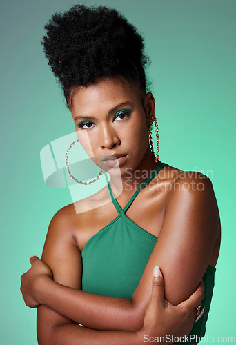 Image of Fashion, beauty and makeup with a green background and black woman in studio for style and empowerment. Portrait, cosmetics and equality with a confident young female standing arms crossed inside