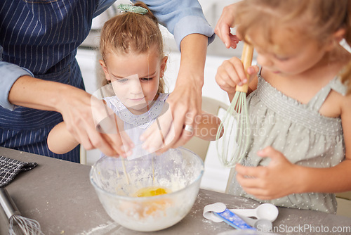 Image of Cooking, girls or bonding mother helping with eggs for dessert, breakfast or sweet recipe in house or family home kitchen. Hands, parent and learning children in baking healthy food and wellness diet