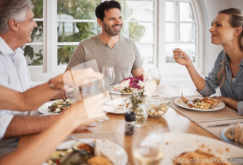 Image of Family, bonding or thanksgiving food on table in house, home or restaurant in party, event or lunch. Happy smile or relax men, woman or senior for festive celebration or nutrition health meal reunion