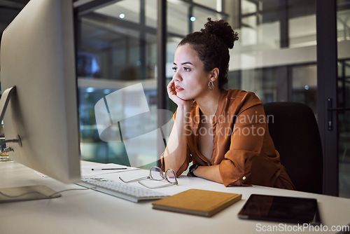 Image of Burnout, report and compliance with a business woman working on a computer in her office late at night. Stress, frustrated and problem with an anxious female employee at work on a company deadline