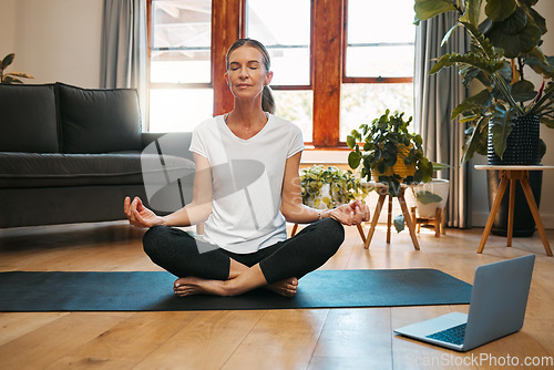 Image of Meditation, laptop and elderly woman learning zen workout online tutorial in living room, happy and content. Fitness, peace and yoga for beginner by senior female enjoy retirement healthy activity