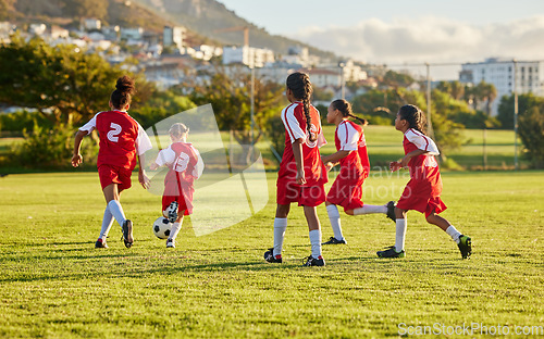 Image of Girl, soccer and fitness team in field sports playing fun game together in training for competition outdoors. Group of female football players in teamwork sport match for health and exercise outside