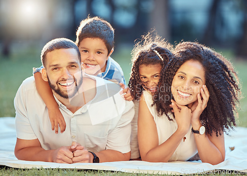 Image of Family, children and smile on grass for portrait on blanket to relax show love, care and happiness. Black mom, dad and kids on picnic in park, garden or backyard smile together in sunshine in Toronto