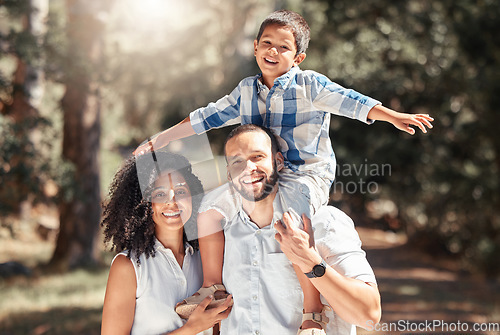 Image of Happy, smile and portrait of a family in forest together having fun in nature while on holiday. Happiness, love and caring parents from puerto rico with their child in woods while on summer vacation.