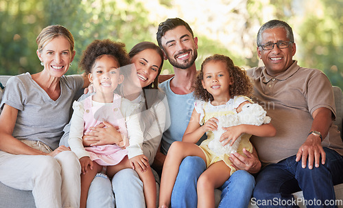 Image of Portrait family, interracial smile and grandparents happy on living room sofa with children, smile together in lounge and relax on couch in house. Kids, mother and father with senior people for visit
