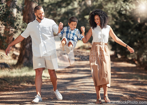 Image of Smile, nature and happy family in a park walking and having fun as a young child plays with mother and father in USA. Love, happiness and parents enjoy quality time and bonding with kid in summer