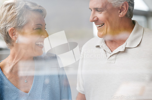 Image of Senior, couple and happy love of woman and a man laughing together in retirement. Elderly people enjoy a funny conversation with happiness, joy and life gratitude smile in a house speaking