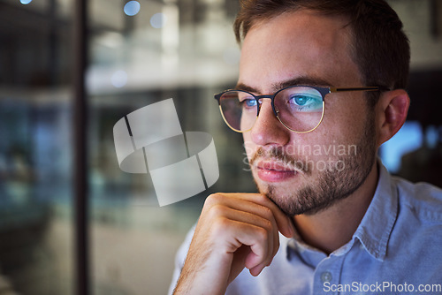 Image of Man, work and reading with reflection on glasses in office thinking of planning strategy for business. Businessman, working and screen of tech at company, workplace or corporate in overtime in night