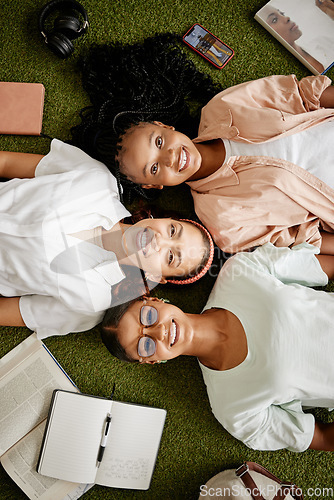 Image of Top view, diversity and students in collaboration, community support or teamwork in study, education or Portugal learning group. Portrait, smile and happy women on campus, college or university grass