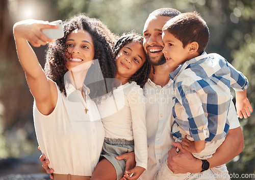 Image of Family selfie with smartphone in a park or nature for outdoor summer wellness, hiking and happy holiday memory on mobile digital gallery. Mother portrait photo of children and father with lens flare