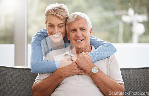 Image of Happy senior couple in living room portrait with love, care and support hug in home living room. Dallas elderly or pension people relax on sofa together and happiness with life wellness or retirement