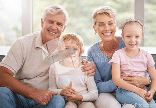 Image of Portrait, kids and grandparents relax on a sofa, bonding and smiling in living room together. Family, happy and retirement with elderly man and woman enjoying free time and babysitting grandchildren