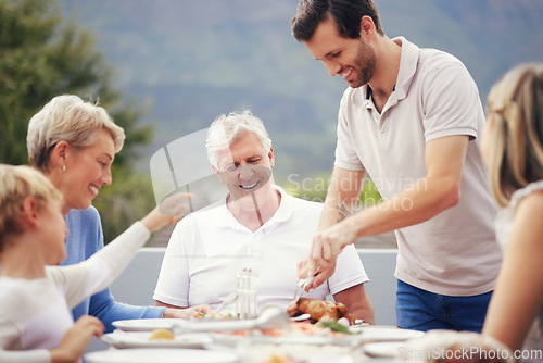 Image of Family eating lunch outdoor garden for holiday celebration, fathers day or thanksgiving turkey food. Happy, care and love people with grandparents and child brunch together in garden to celebrate dad