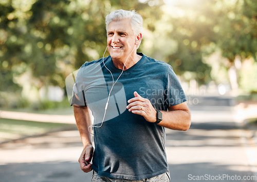 Image of Senior man running while listening to music outdoor street and park for fitness, wellness or healthy lifestyle with summer lens flare bokeh. Elderly person exercise, workout or jogging with earphones