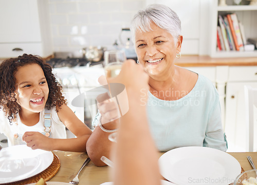 Image of Champagne toast and grandmother for mothers day celebration in home kitchen dining room with children. Happy elderly person with wine glass celebrate mothersday, birthday or happy lifestyle with kid