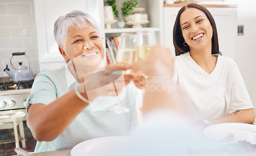 Image of Champagne, old woman and toast pov of person with grandmother and daughter in home kitchen. Cheers, celebration and smile with alcohol glass, beverage or wine drink cheer at party or family gathering