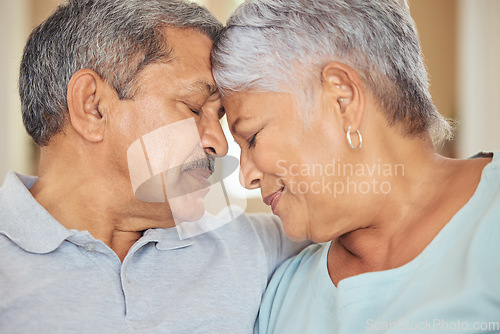 Image of Senior couple, forehead touch and love in house or Indonesian home living room in support, trust and security. Zoom, face and retirement elderly man and happy woman in marriage therapy and counseling