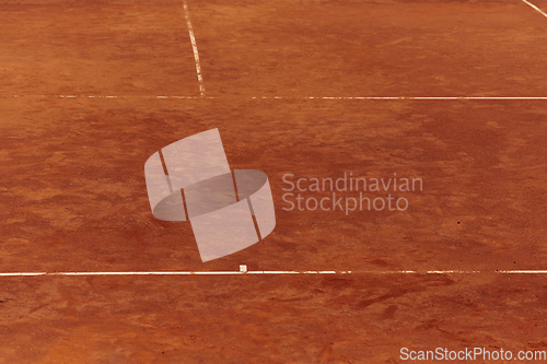 Image of A close up picture of the tennis court with marked lines