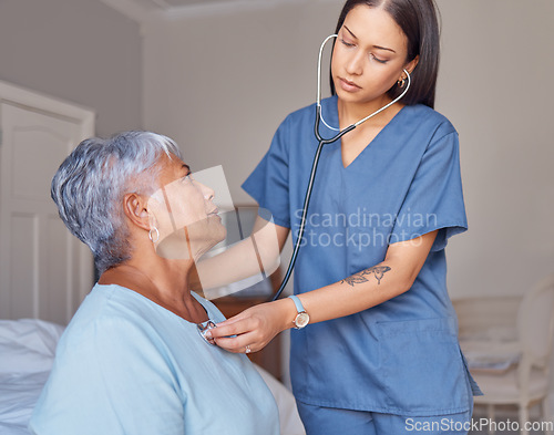 Image of Doctor, stethoscope and senior woman with caregiver checking health, heart rate and beat at home. Young female healthcare GP or nurse helping elderly patient check heartbeat for medical care indoors