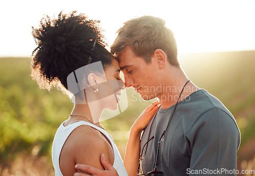 Image of Love, travel and couple in mexico, hug and share intimate moment in countryside, bond at sunset. Freedom, nature and interracial man and woman embrace, talk and enjoy relationship in florida field
