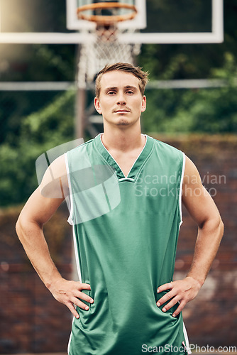 Image of Basketball player, sports and portrait of a man on a court ready to play a training match for exercise outdoors in USA. Young and serious person serious about fitness, workout and healthy lifestyle