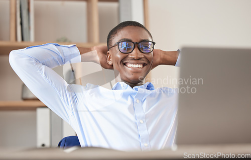 Image of Black man, relax and laptop in office break, social media or web browsing after successful business deal. Leader, ceo or manager in Nigeria resting after writing email or planning finance strategy.