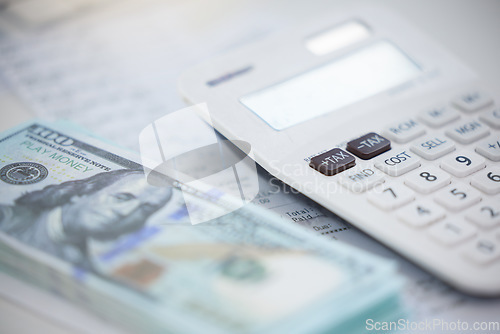 Image of Finance, money and calculator with cash on an accounting desk in an office from above. Wealth, savings and investment with dollar currency on a table for growth, inflation or stock in the economy