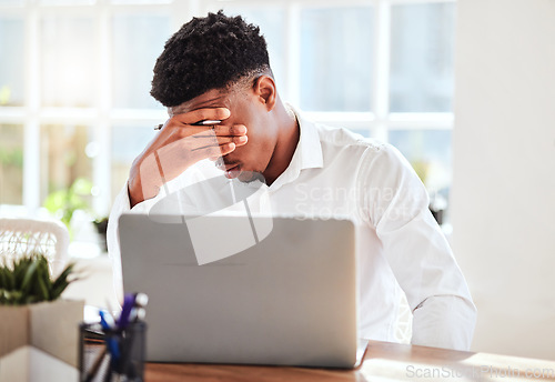 Image of Burnout, headache and stress finance manager feeling sick, tired and anxiety about a financial problem at his startup company. Tired and frustrated professional businessman working at an office