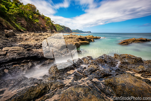 Image of Long exposure, pacific ocean waves on rock in Playa Ocotal, El Coco Costa Rica