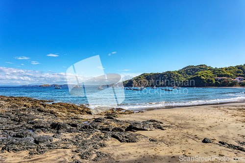 Image of Playa Ocotal and Pacific ocean waves on rocky shore, El Coco Costa Rica