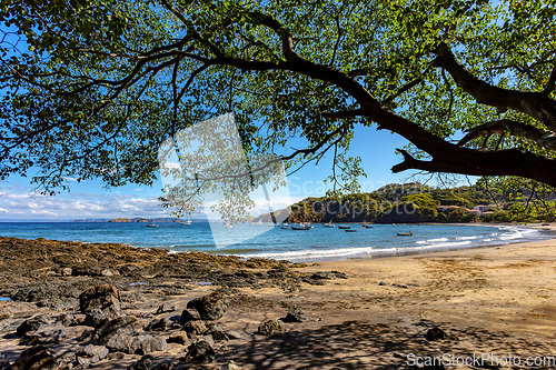 Image of Playa Ocotal and Pacific ocean waves on rocky shore, El Coco Costa Rica