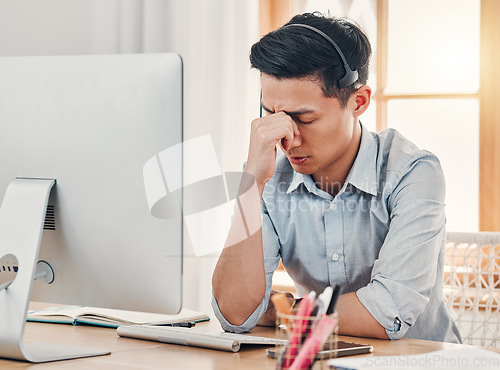 Image of Headache, burnout and stress call center businessman with computer for information technology. Asian online IT support agent, virtual advisor or telemarketing worker tired, frustrated and depression