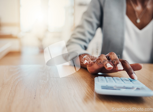 Image of Calculator, bank and hand of finance black woman calculate loan balance, insurance tax or financial business profit. Accounting, administration and accountant doing company bookkeeping or calculation