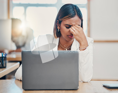Image of Stress, laptop and headache with a woman tax compliance officer struggling with burnout while working on a report or audit. Mental health, regulations and risk with a female employee making a mistake