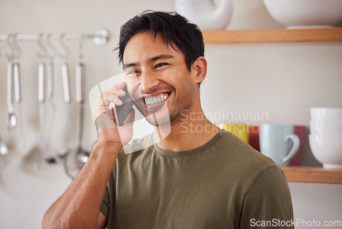 Image of Happy man, phone call and communication in home kitchen for conversation, connection and talking in Colombia. Smile young guy speaking on smartphone, cellphone discussion and mobile technology hello