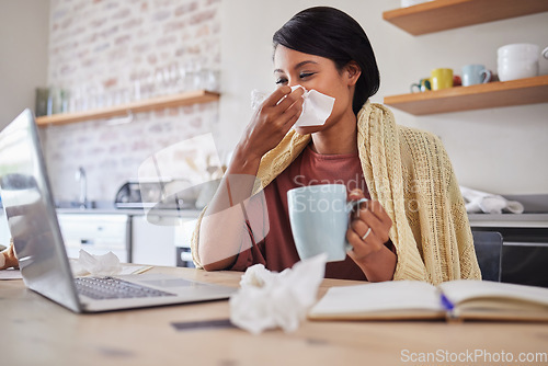 Image of Sick, tea and business woman with covid while reading an email on a laptop and working from house. Remote entrepreneur blowing nose with flu and drink of coffee while planning work on web in her home