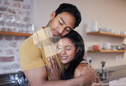 Image of Care, love and happy couple hug and relax at home enjoying quality time together. Loving and romantic lovers bonding and cuddling in the house expressing feelings of happiness, smile and romance