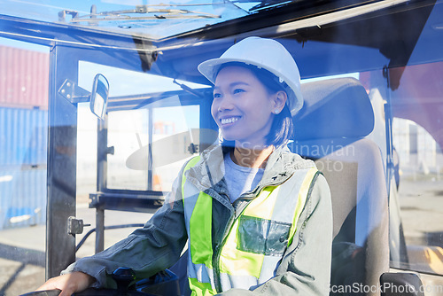 Image of Logistics, supply chain and transport with a woman shipping worker driving a vehicle on a commercial container dock. Freight, cargo and stock with an asian female courier working in a storage yard