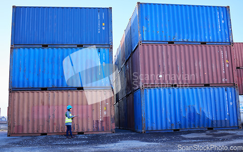 Image of Logistics, supply chain and woman in container port checking inventory list for global freight company. Industrial shipping yard, female inspector counting cargo stack for delivery in storage area.