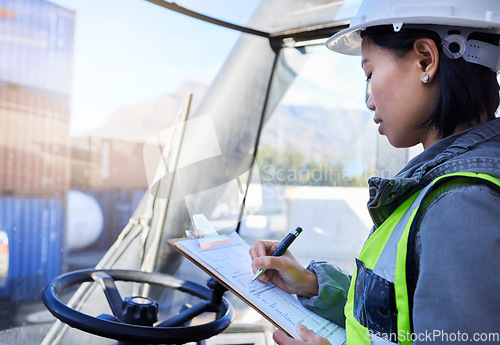 Image of Cargo, shipping and woman in truck writing inventory notes on clipboard in shipment yard. Professional freight worker with checklist for organisation, logistics and stock distribution plan.