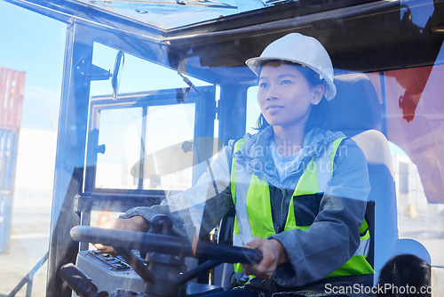 Image of Supply chain, logistics and transport with a woman shipping worker driving a vehicle on a commercial container dock. Freight, cargo and stock with an asian female courier at work in the export trade