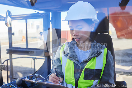 Image of Shipping, documents and transport with a woman logistics expert working in the supply chain or export industry. Freight, cargo and stock with an asian courier at work in a storage or container yard