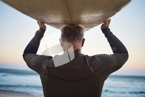 Image of Surfer with surfboard before surfing and sea waves in nature outdoor, extreme sports or adrenaline activity. Back of sporty man walking to a ocean beach water in summer for surf training on vacation