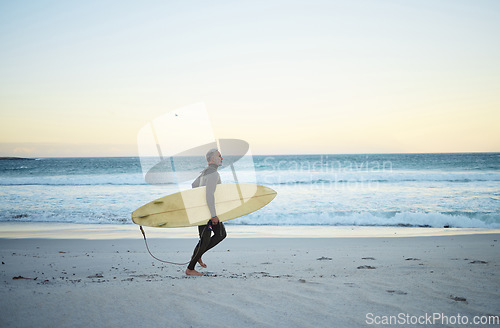 Image of Beach, water and surf of a man on sand with surfboard walking the ocean coast in the morning outdoors. Male surfer running with longboard in Costa Rica for healthy fitness and travel on vacation