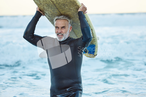 Image of Beach, board and man surfing the waves in the water on holiday in the Maldives during travel in summer. Mature surfer happy and thinking with smile in ocean on vacation in nature for peace and calm