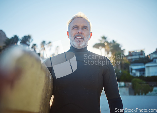 Image of Beach, surfer and old man at sea ready to start surfing on summer holiday vacation in his retirement in Hawaii. Freedom, ocean and senior man with surfboard feeling confident, excited and happy