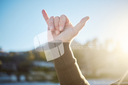 Image of Shaka, hand sign and surfer outdoor in nature on an adventure or holiday in summer in hawaii. Chill out gesture, friendly and man with surf culture on tropical vacation for fun, leisure and freedom.