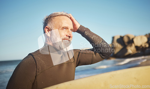 Image of Elderly, man and beach to surf in summer for wellness, fitness and health on adventure. Senior, ocean and surfer in sun, waves and sea in retirement to relax, exercise and workout in water in Cancun