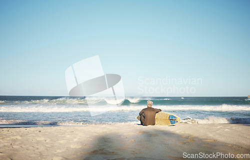 Image of Surf, sea and sports with a man on the beach for surfing, fitness or training with a horizon view and sky mockup. Workout, exercise and health with a male surfer sitting on sand with his surfboard